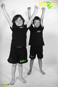 young girl and boy arms up celebrating